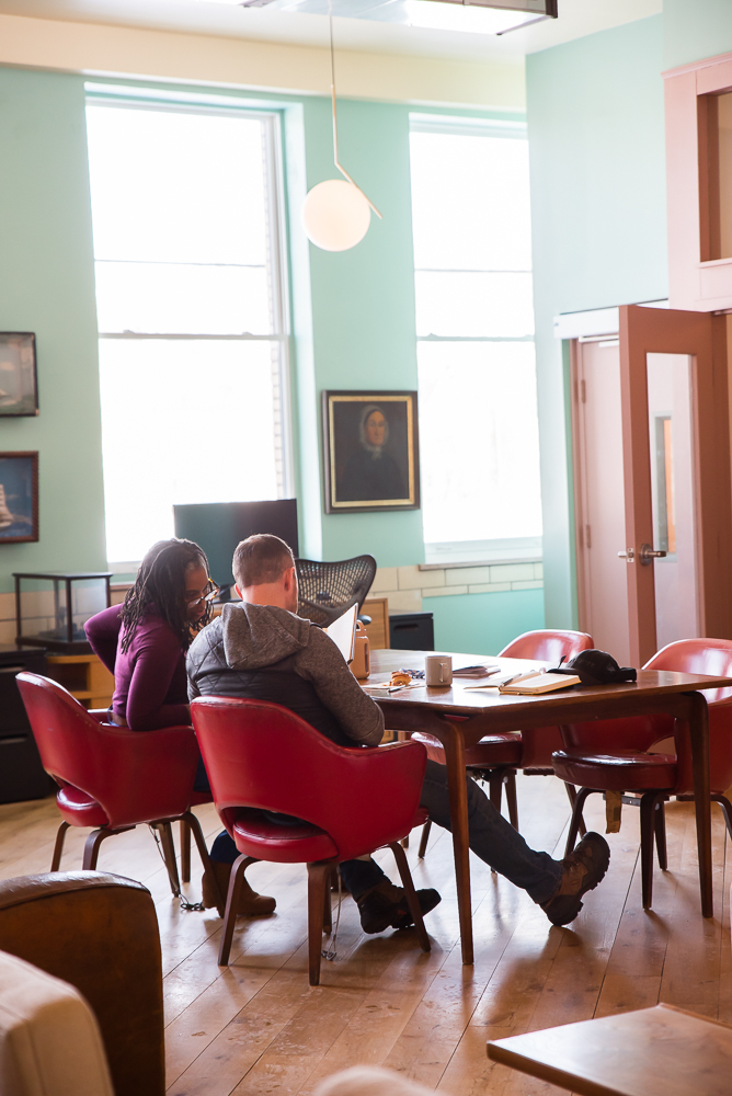 Two members in conversation at Fulton Commons Pittsburgh